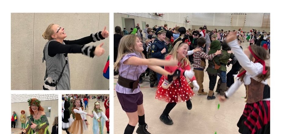 Impressionen von der Feier in der Turnhalle. Kostümierte Kinder tanzen zur Musik.